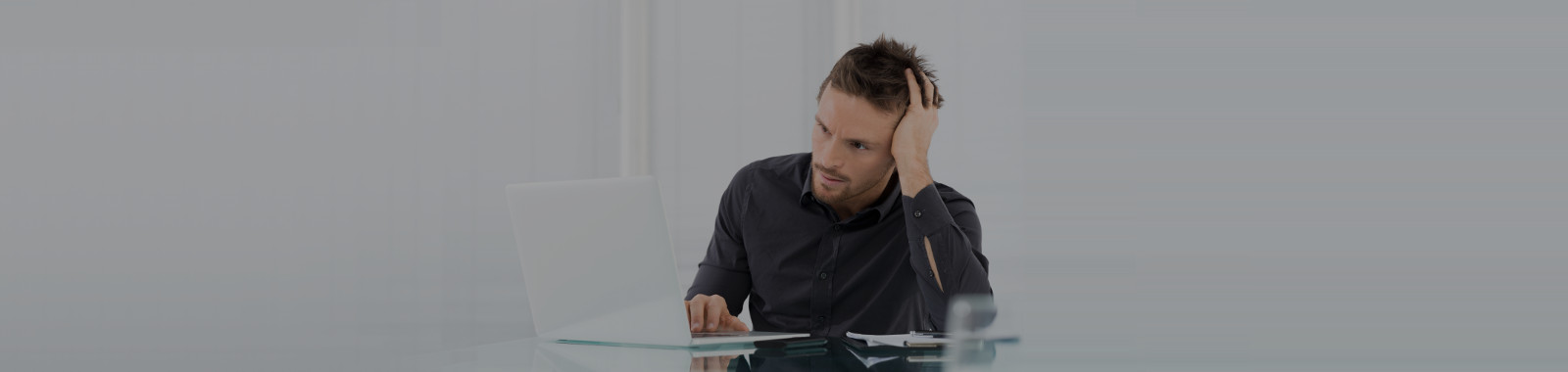Stressed Man Working On Laptop