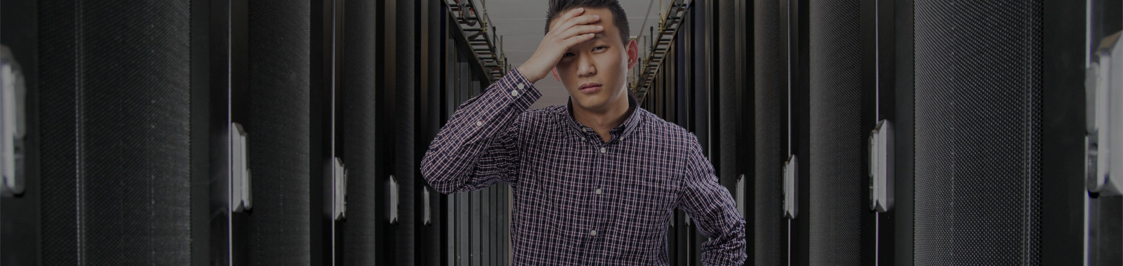 Black server cabinet in the basement with a white ceiling